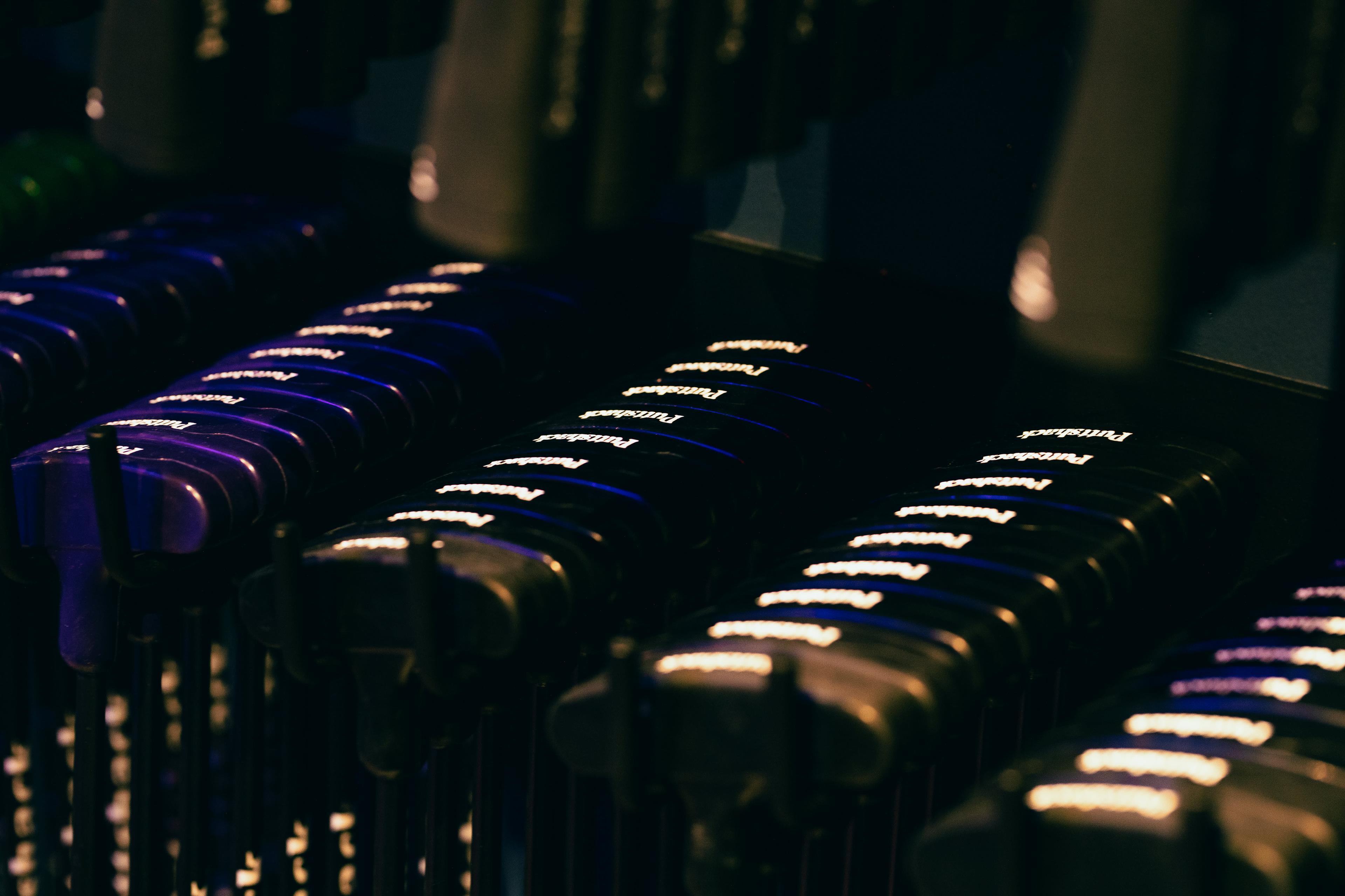 Glamor shot of the rack that holds Puttshack's putters 