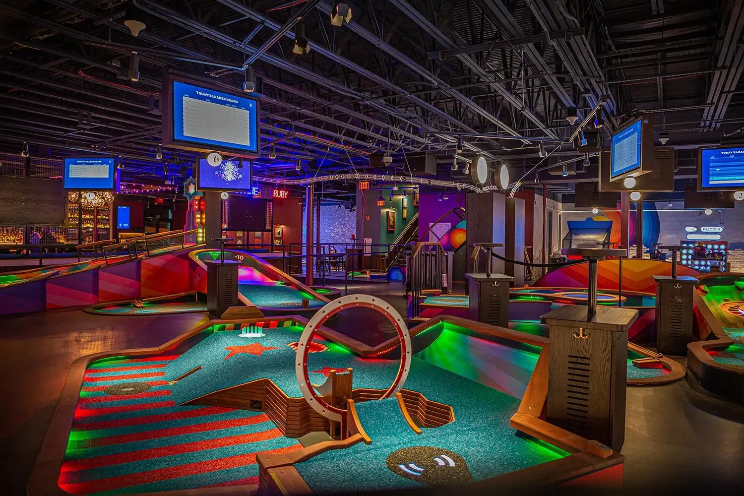 wide angle shot of multiple courses at a Puttshack location