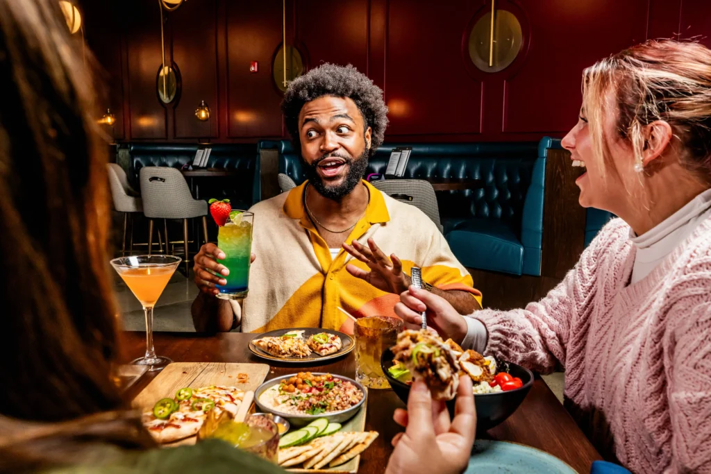 People chatting over food and drinks