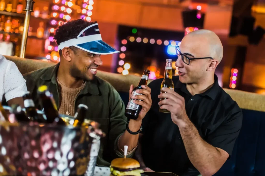 Two men holding beers
