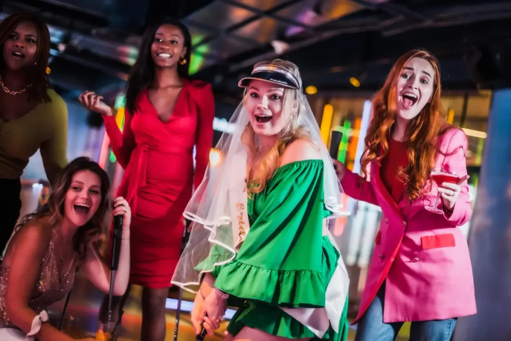 Women partying and golfing at Puttshack