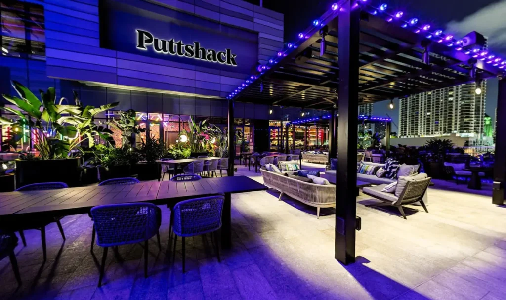 Puttshack Miami outdoor patio with blue LED lights