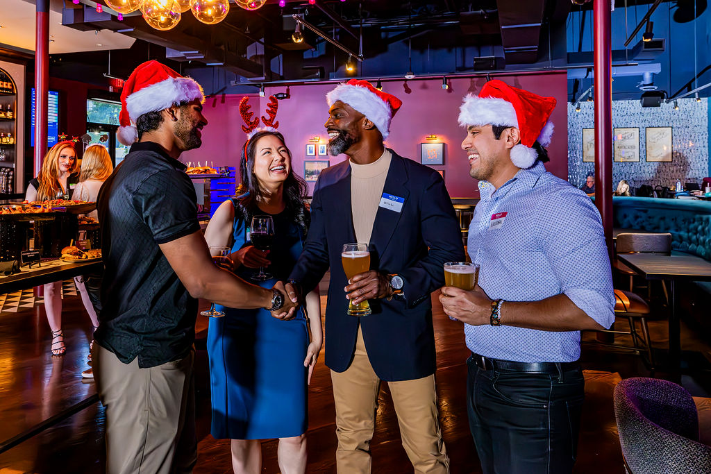 A corporate team of colleagues at a Christmas party venue at Puttshack mini golf